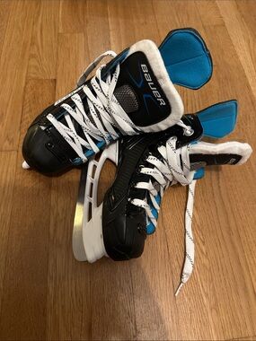 Youth Bauer Black Hockey Skates with Blue Accents